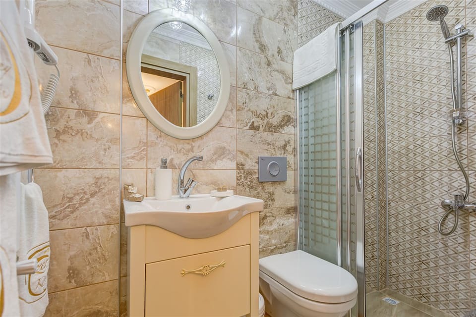 Standard Double Room | Bathroom | Shower, free toiletries, hair dryer, slippers