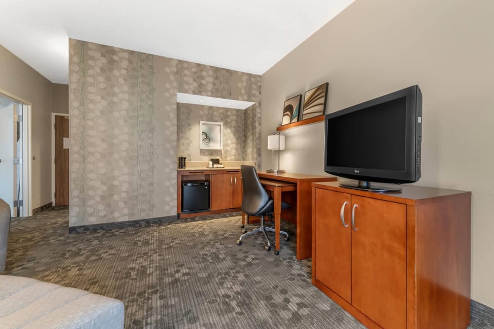 Suite, Multiple Beds, Non Smoking | Desk, laptop workspace, blackout drapes, iron/ironing board
