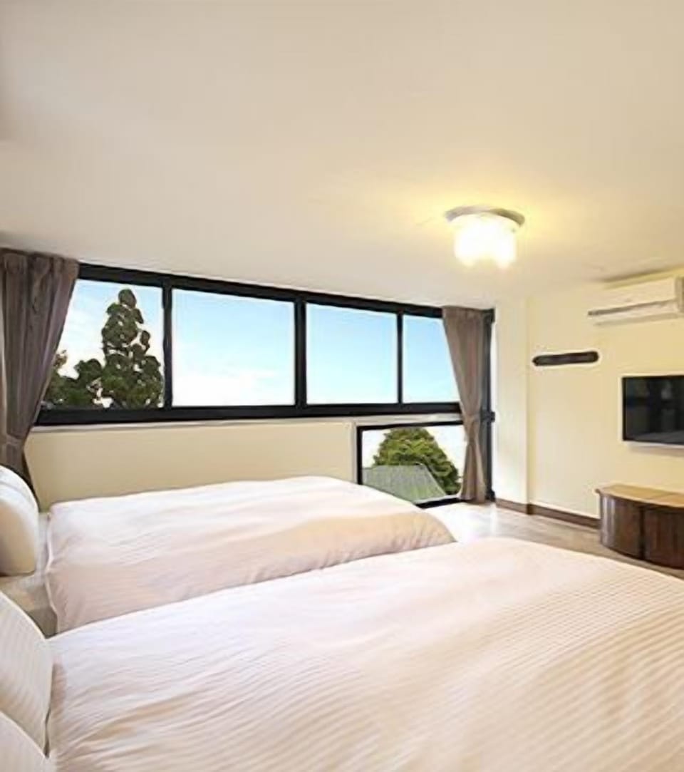 Comfort Quadruple Room, 2 Double Beds, Resort View (M) | 1 bedroom, free WiFi, bed sheets