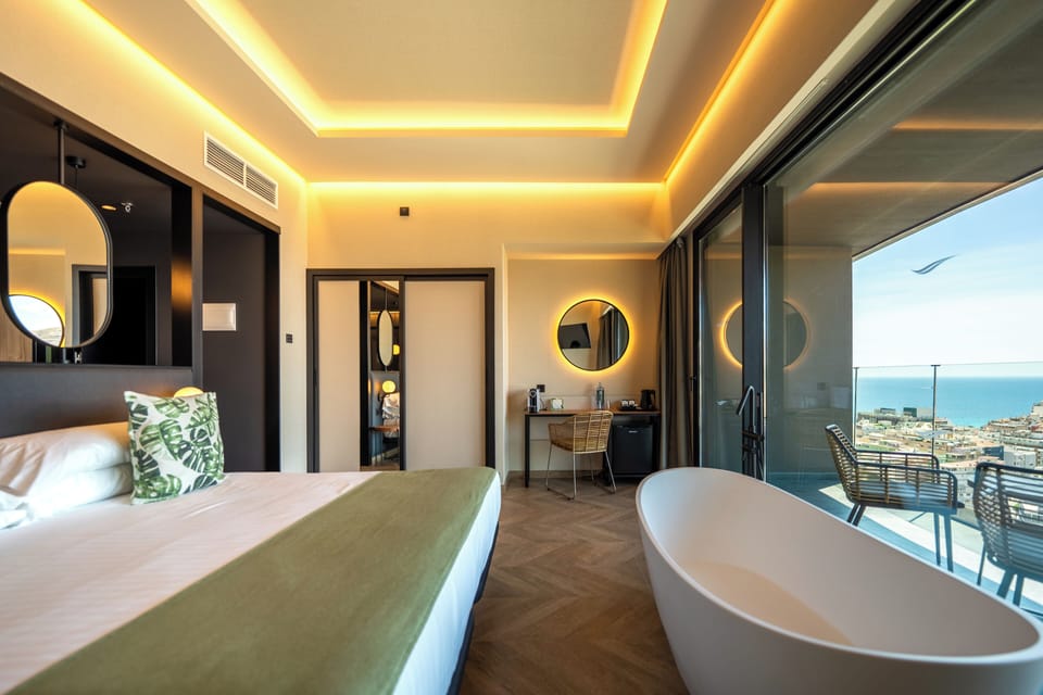 Panoramic Penthouse, 1 King Bed, Terrace, Sea View | Minibar, individually furnished, desk, blackout drapes