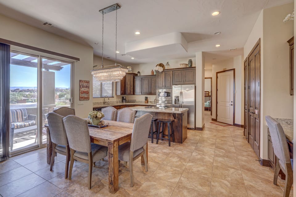 Large open kitchen with island and dining area. Access to front patio. 