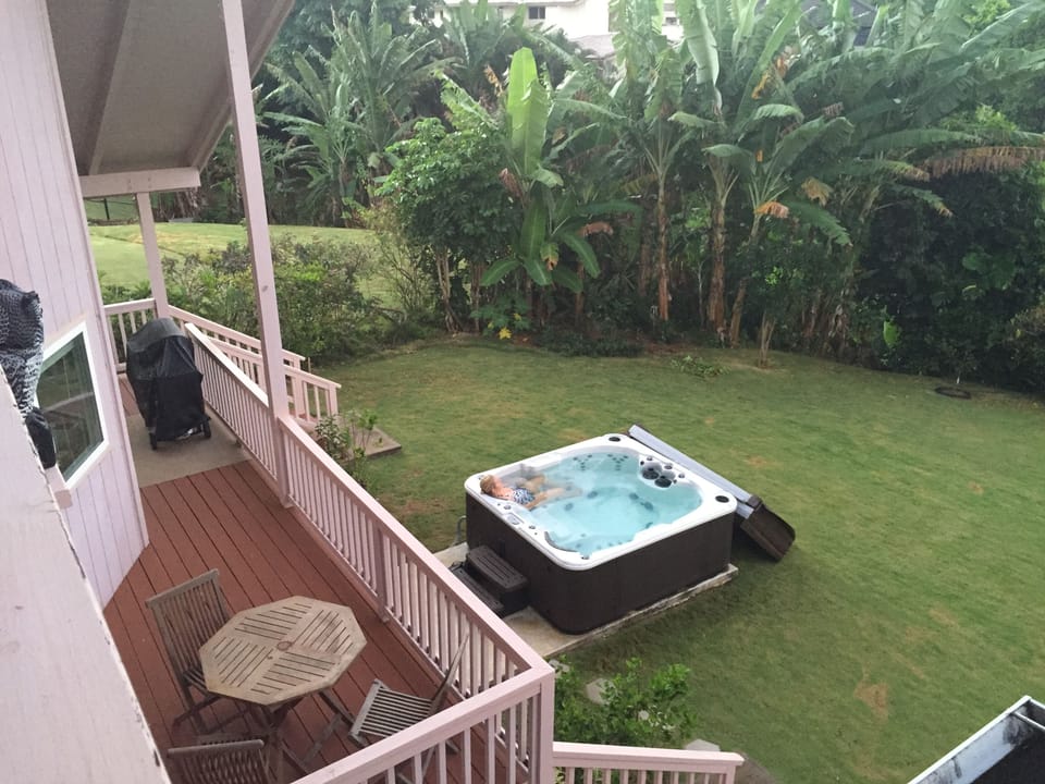 Relax in the private 4-person hot tub overlooking the mountain waterfalls.