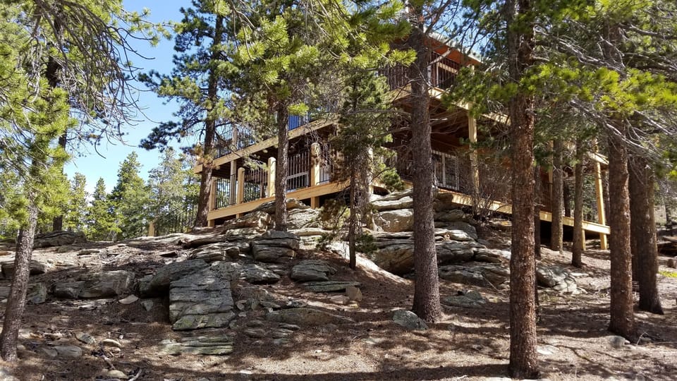 Mountain home with two story wrap-around deck.