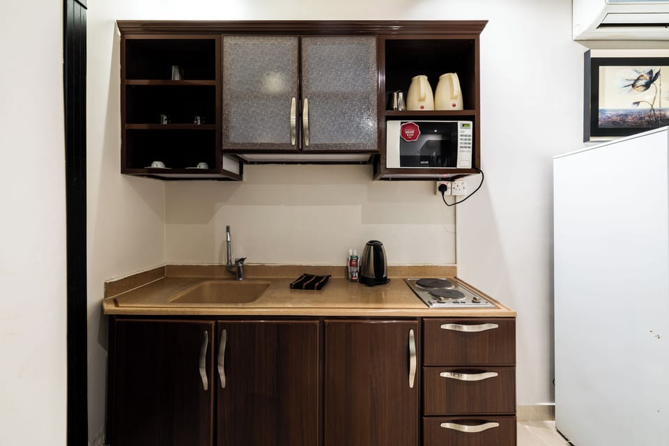 Apartment, 1 Bedroom, Kitchen | Private kitchen | Fridge, electric kettle, cleaning supplies