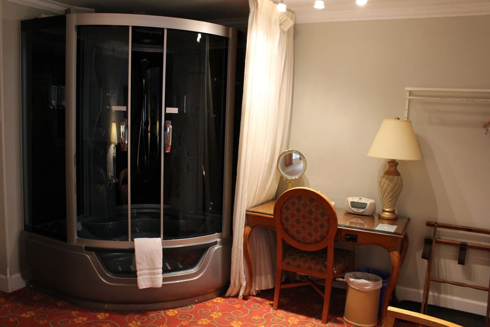 Room, 2 Double Beds, Jetted Tub | Blackout drapes, iron/ironing board, WiFi (free), bed sheets