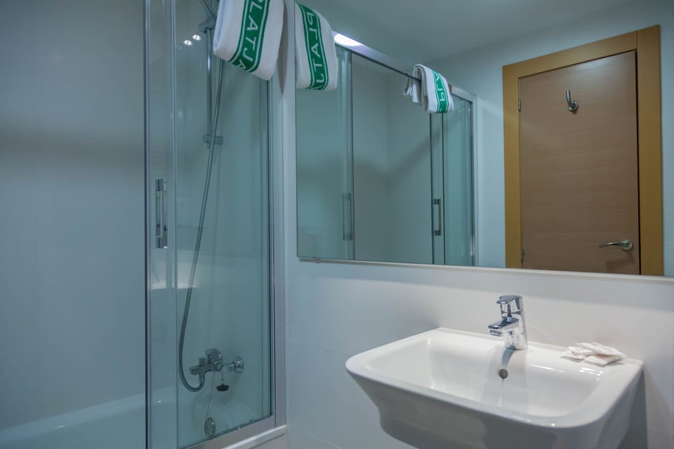 Rainfall showerhead, towels, soap, shampoo