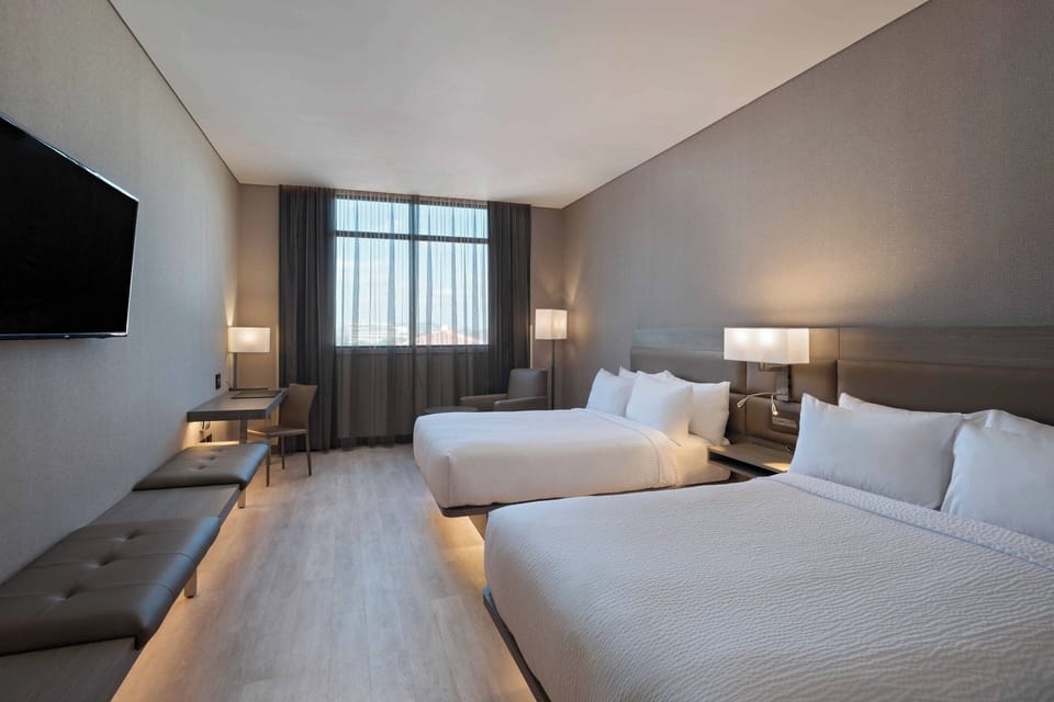 Room, 2 Double Beds | In-room safe, desk, blackout drapes, soundproofing