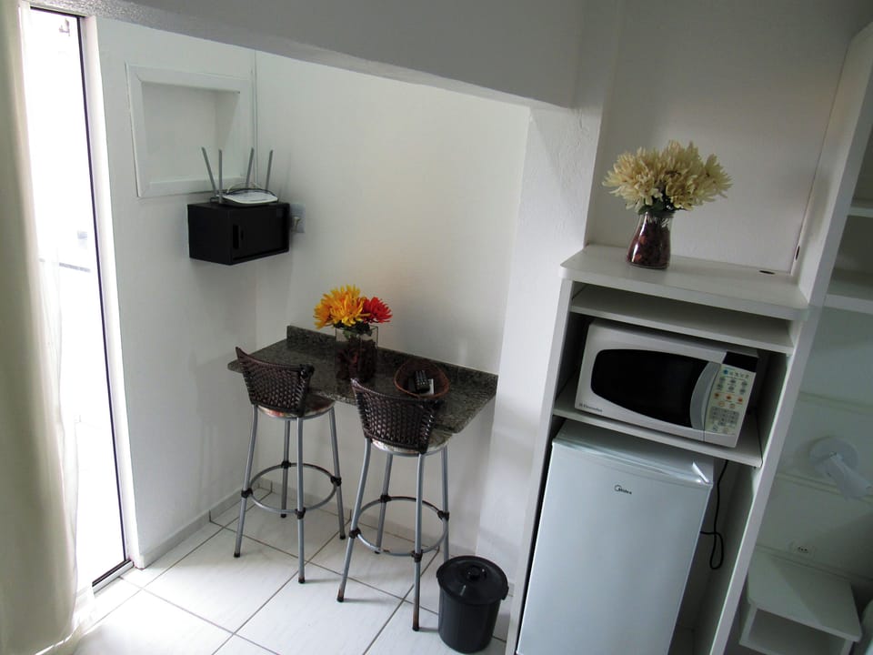 Standard Suite, Kitchenette | Private kitchen | Fridge, microwave, stovetop, cookware/dishes/utensils