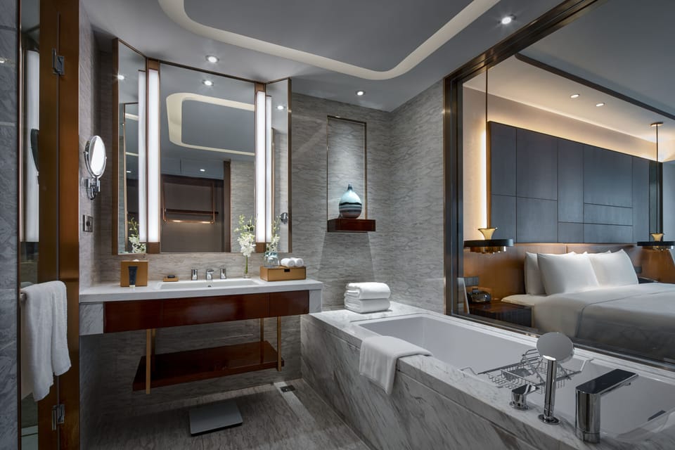Separate tub and shower, designer toiletries, hair dryer, bathrobes