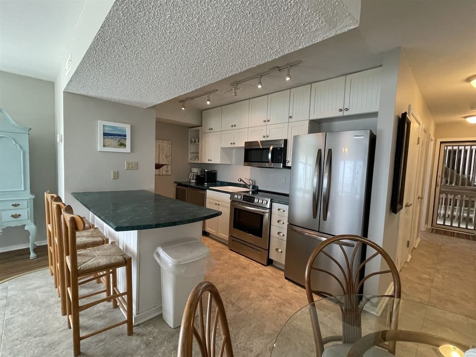 Condo, 1 Bedroom | Private kitchen | Coffee/tea maker, full-size fridge, microwave, stovetop