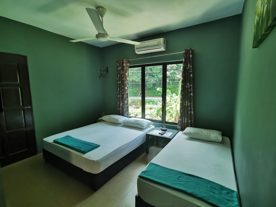 Triple Room, Private Bathroom (External) | Iron/ironing board, free WiFi, bed sheets