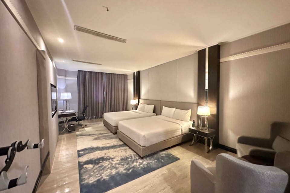 Deluxe Room, 2 Queen Beds, Non Smoking | Minibar, in-room safe, desk, laptop workspace