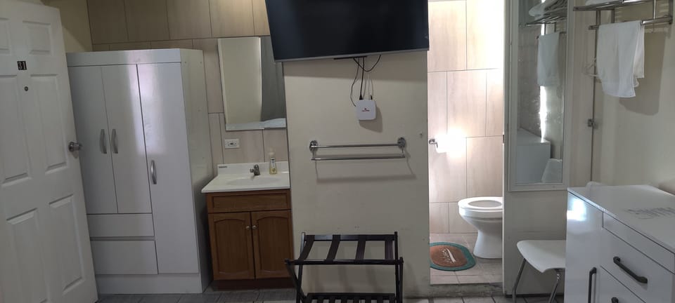 Economy Quadruple Room, 1 Bedroom | Bathroom | Shower, hydromassage showerhead, free toiletries