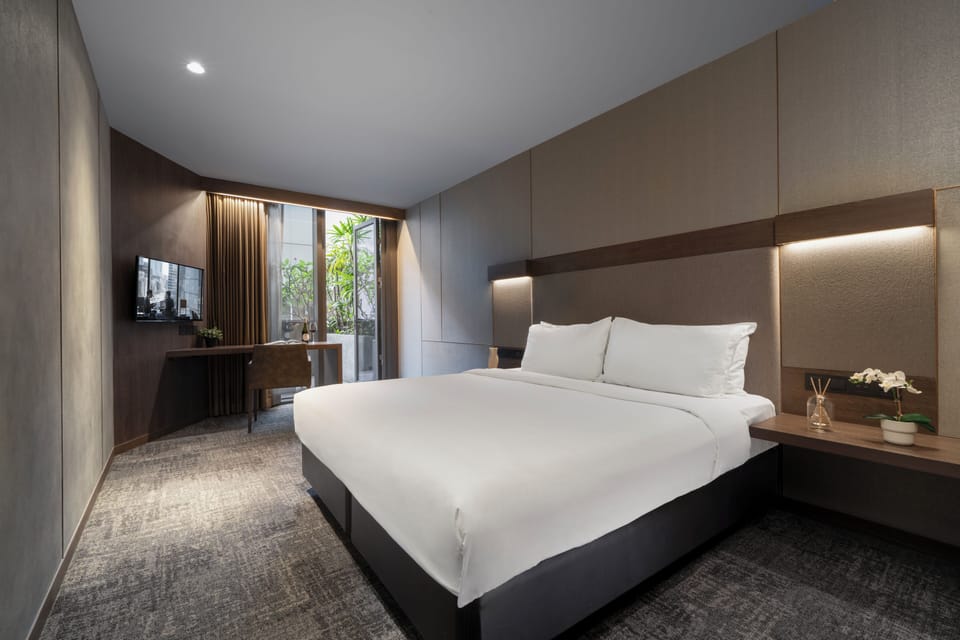 Deluxe Room, 1 King Bed, Balcony | In-room safe, desk, iron/ironing board (on request), cribs (free)