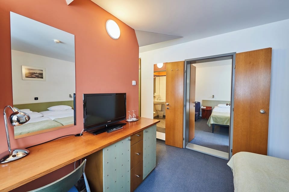 Family Room, 2 Bedrooms | Minibar, in-room safe, desk, blackout drapes