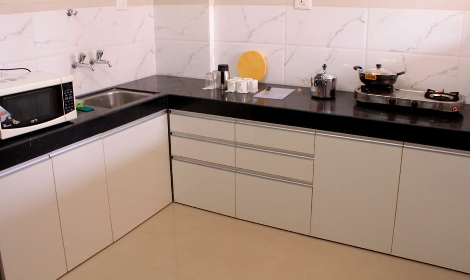 Family Apartment, 2 Bedrooms, City View | Private kitchen | Fridge, cookware/dishes/utensils, dining tables
