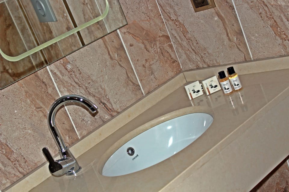 Shower, free toiletries, hair dryer, slippers