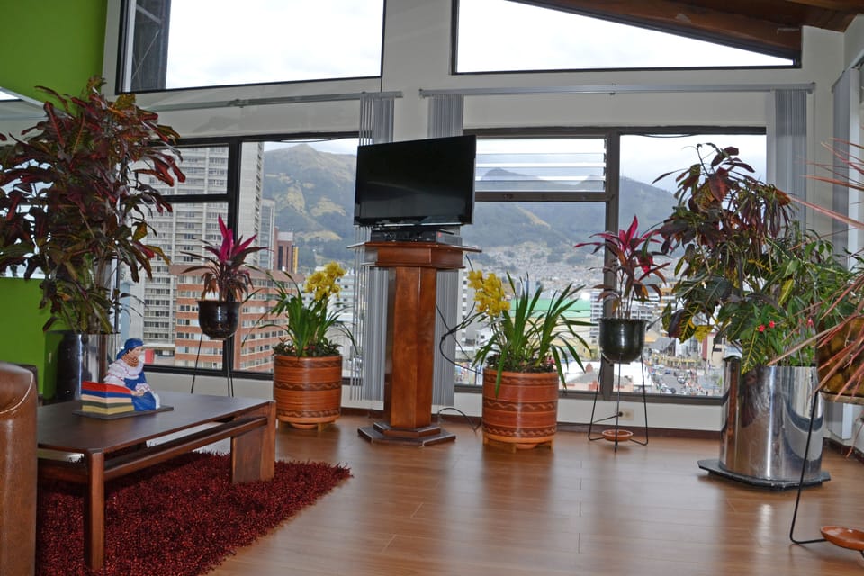 Exclusive Loft, 4 Bedrooms, City View | Living area | Flat-screen TV