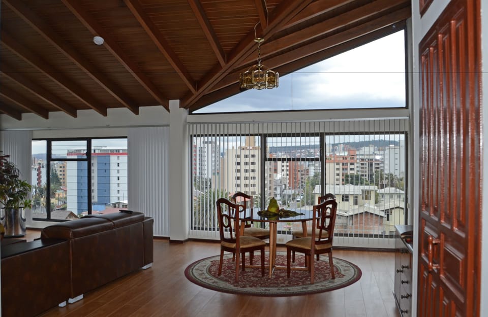 Exclusive Loft, 4 Bedrooms, City View | Living area | Flat-screen TV