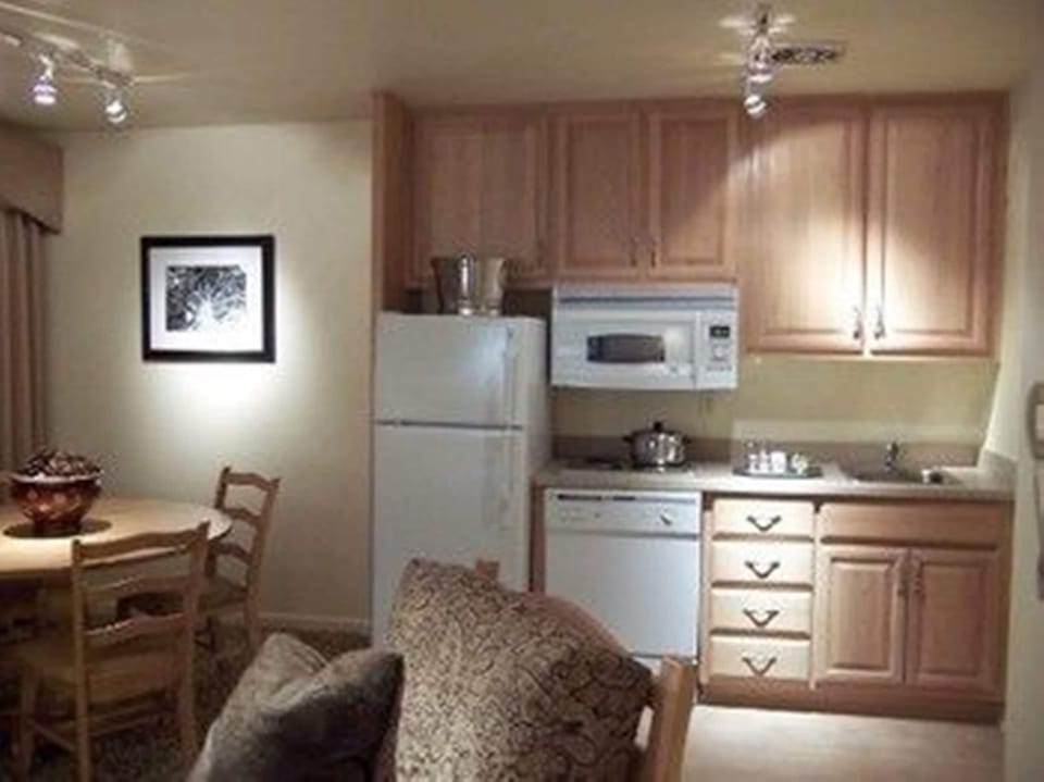 Full-size fridge, microwave, coffee/tea maker, cookware/dishes/utensils