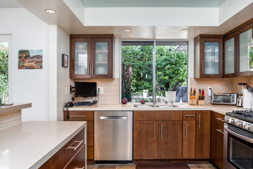 Kitchen looking out toward back gardens. Bosch dishwasher. 