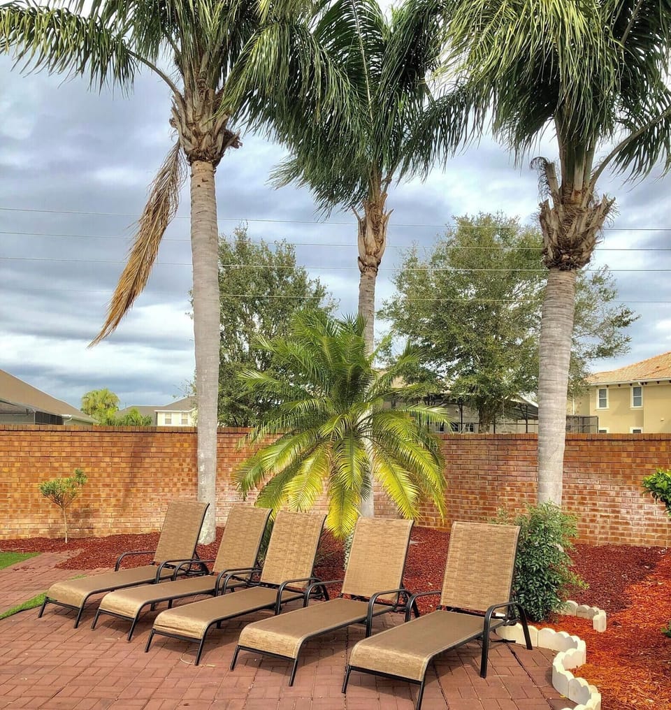 Relax while working on your tan under the swaying palm trees