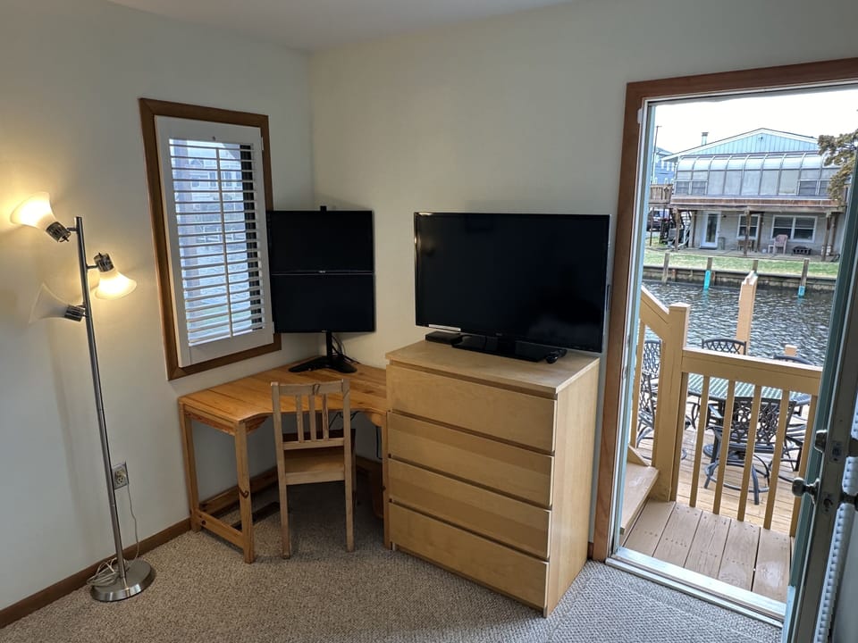 BDRM 2 - Another view of the dual-monitor workstation, dock, deck & canal view