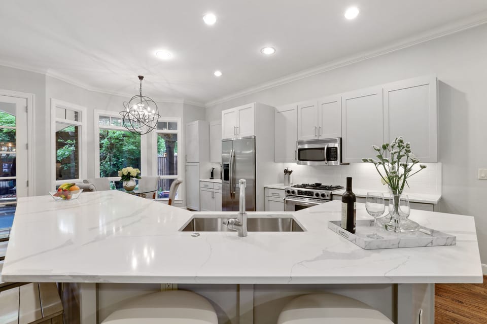 Recently remodeled kitchen with beautiful quartz counters