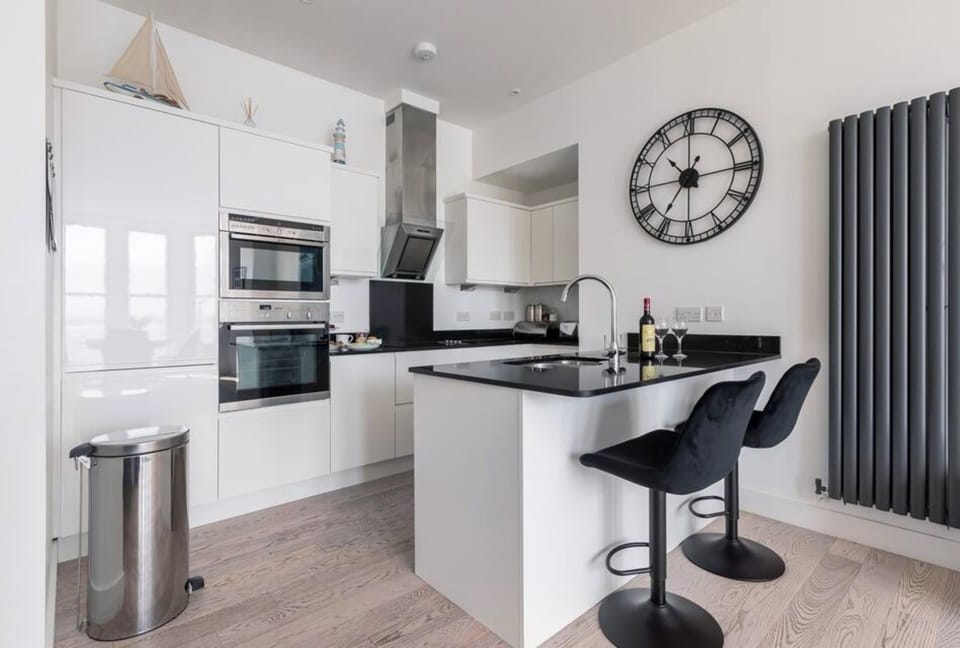 Kitchen - breakfast bar, double oven, wine cooler, fridge, freezer & dishwasher