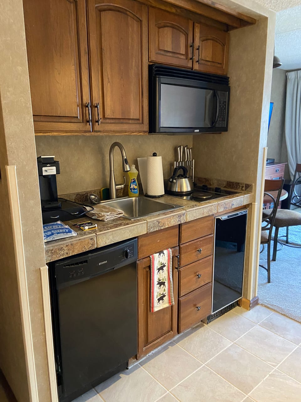 Kitchenette with griddle, k cup coffee maker freezer refrigerator cooktop
