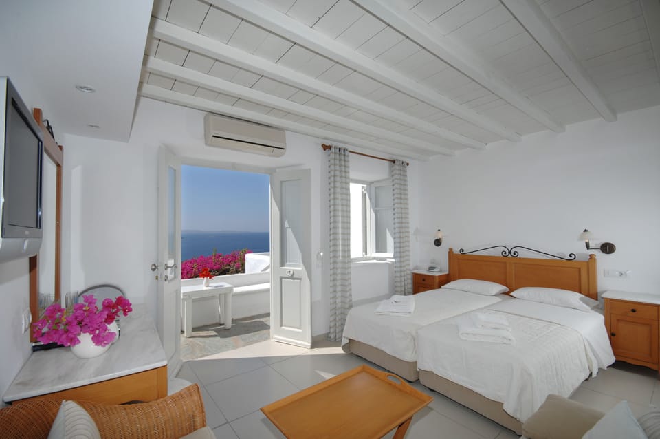 Family Room, Sea View (Superior) | Living area | Flat-screen TV