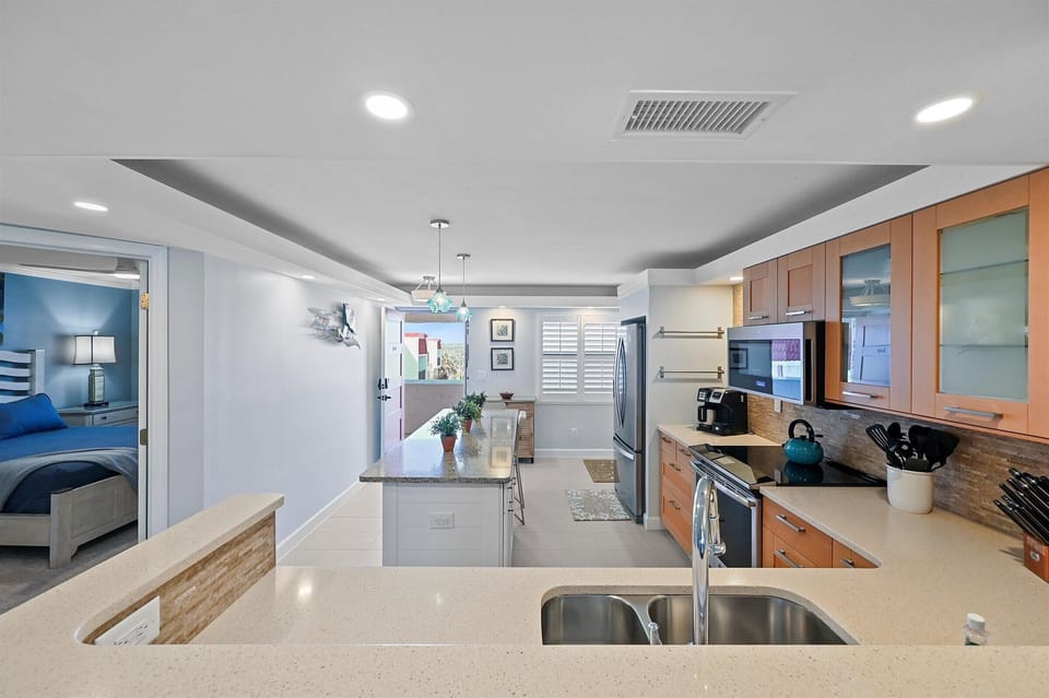 View from dining room to entry door through kitchen
