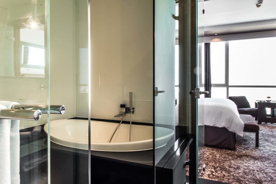 Separate tub and shower, rainfall showerhead, designer toiletries