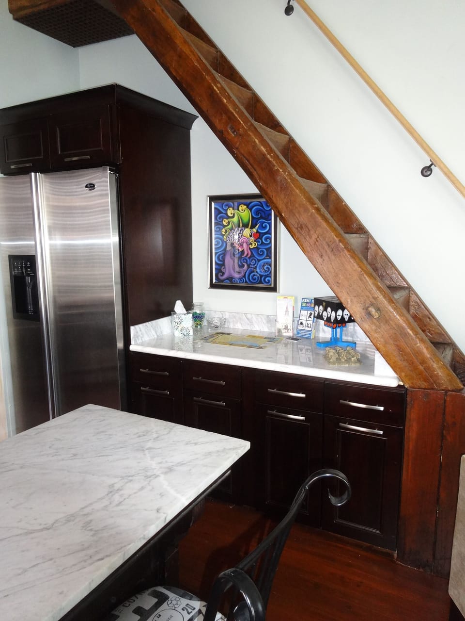 Fridge has ice & water dispenser. Counter under stairs has maps and info for you