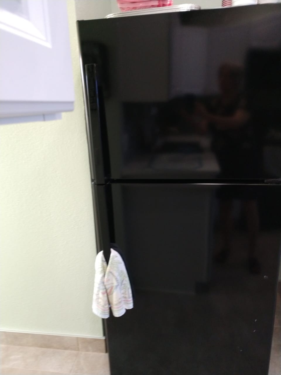 Full size refrigerator with ice maker.