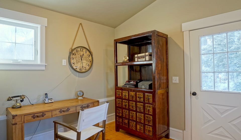 Travel-themed office attached to master suite.