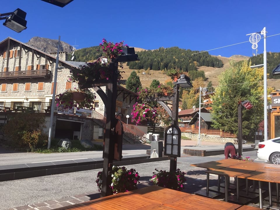 Watching the world go by from one of the many restaurants in Les 2 Alpes 