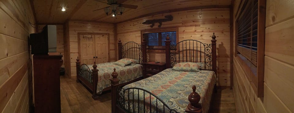 Guest bedroom on main floor can sleep four plus space for two portable beds.