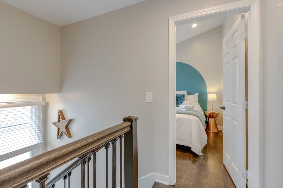 Quiet upper-level hallway leading to comfortable bedrooms