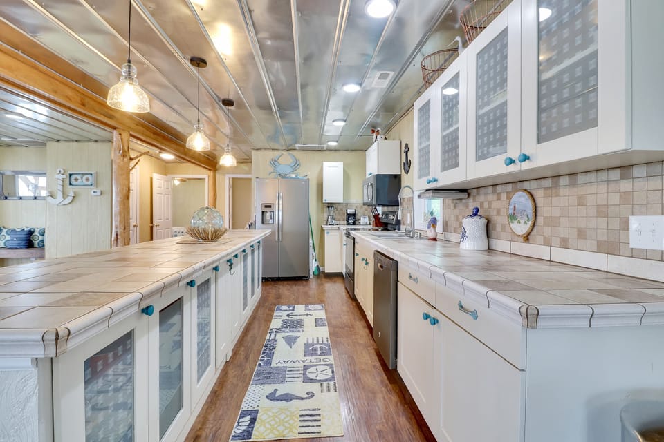 Galley kitchen with a long bar.