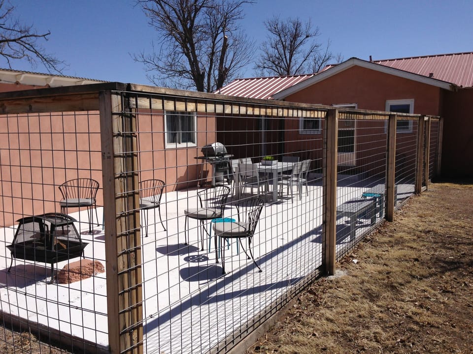 HUGE fenced back patio area with grill and fire pit...A great place to relax!