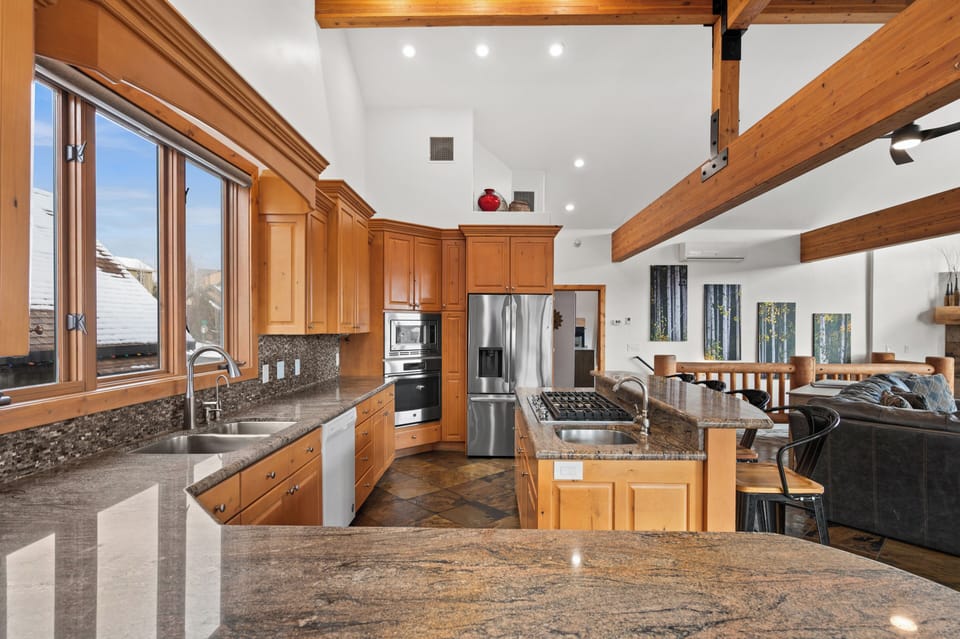 Gourmet kitchen is open to living room and dining