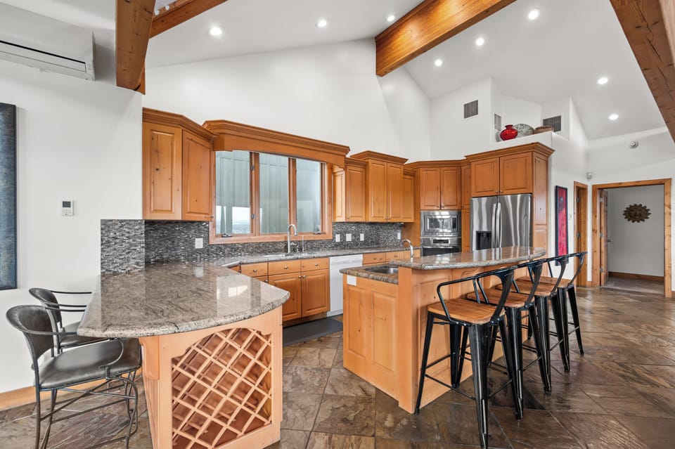 Gourmet kitchen is open to living room and dining 