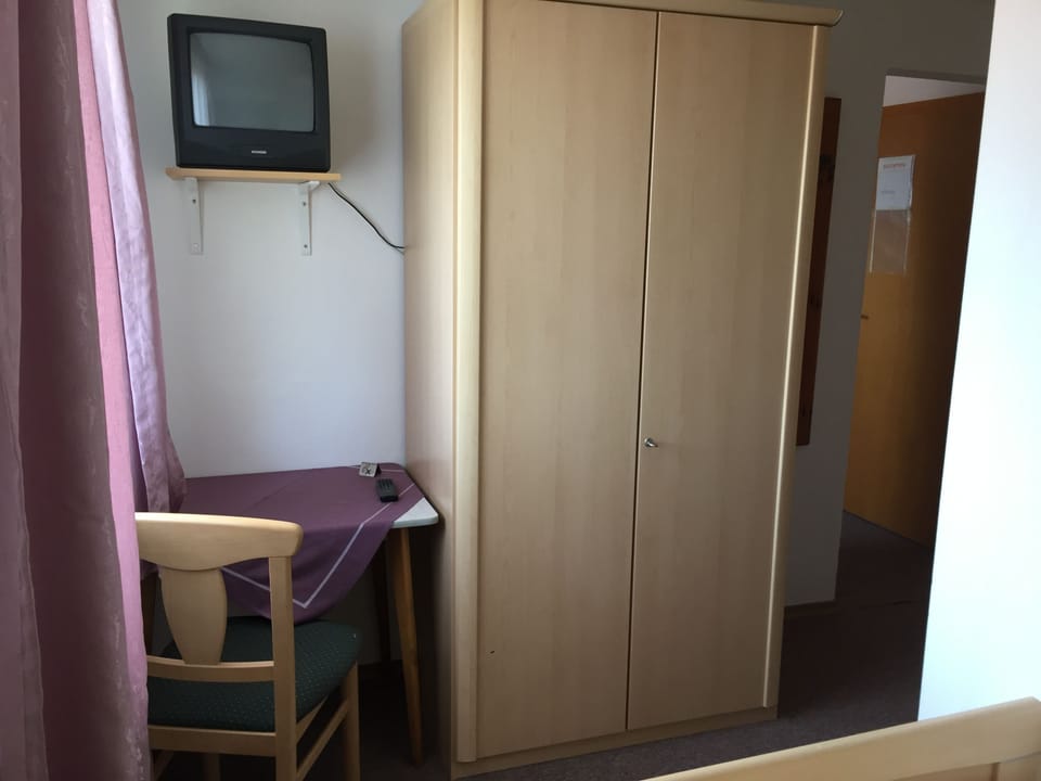 Standard Triple Room | Living room | Flat-screen TV