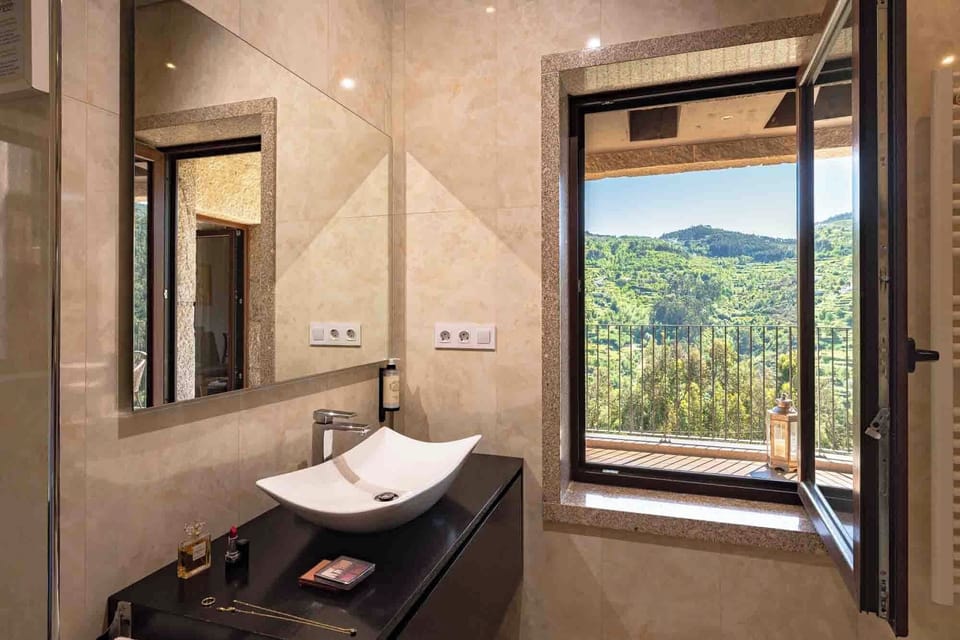 Grand Suite, 1 Bedroom, River View | Bathroom | Jetted tub, rainfall showerhead, designer toiletries, hair dryer