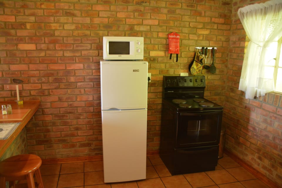 Superior Bungalow | Private kitchen | Coffee/tea maker, full-size fridge, microwave, oven