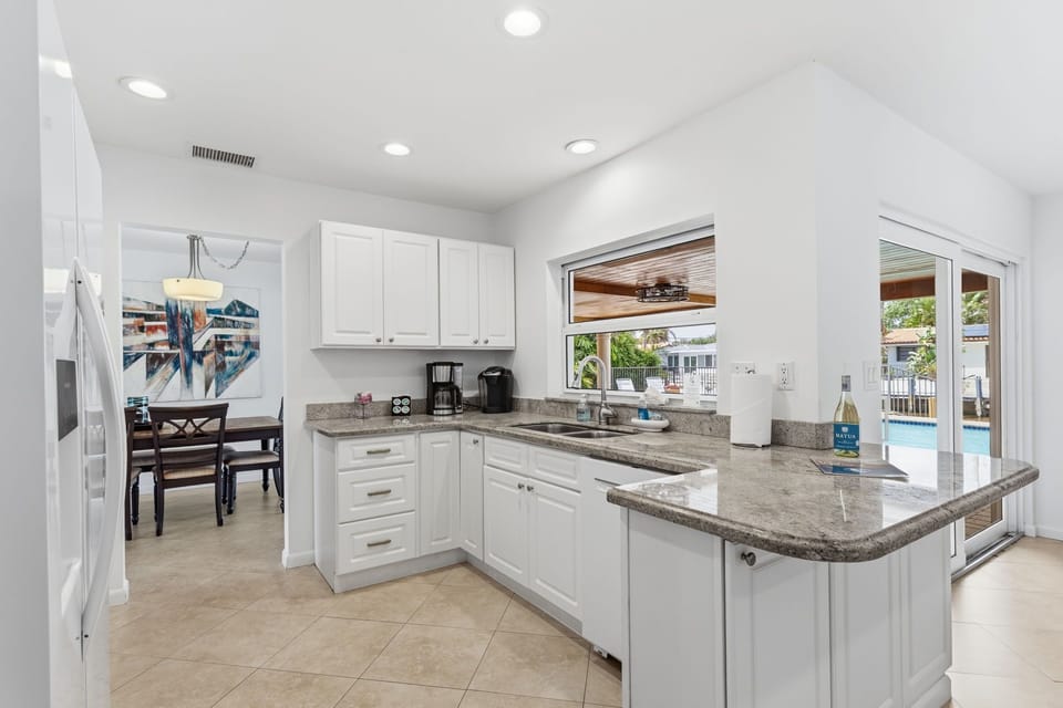 Bright, updated kitchen with sleek finishes and modern style.