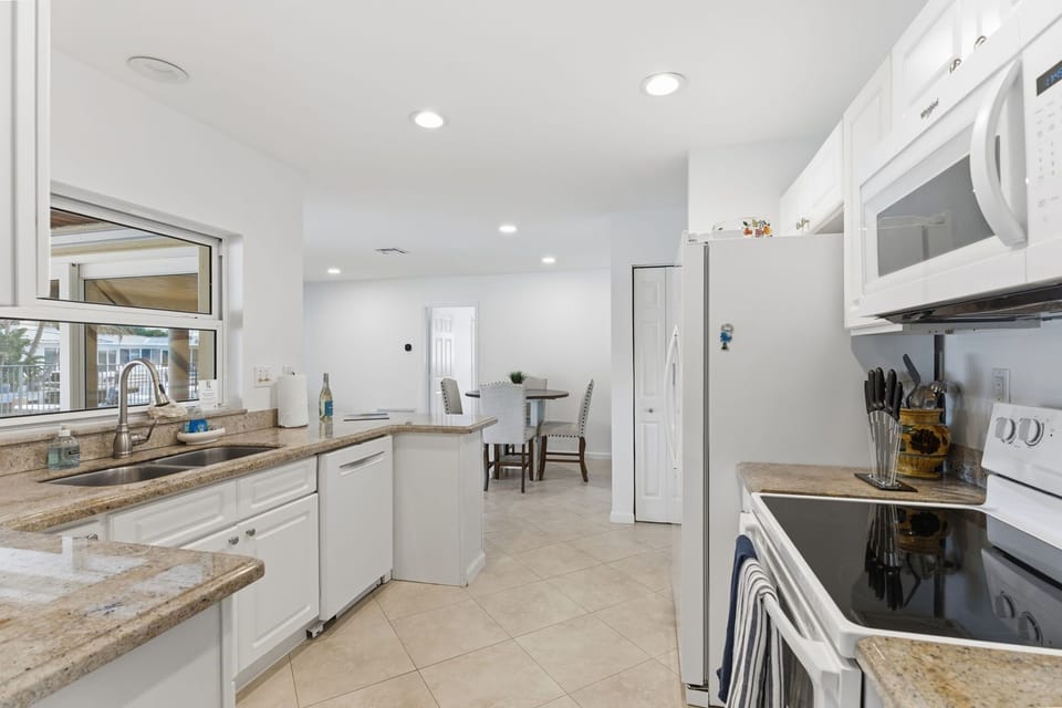 Bright, updated kitchen with sleek finishes and modern style.