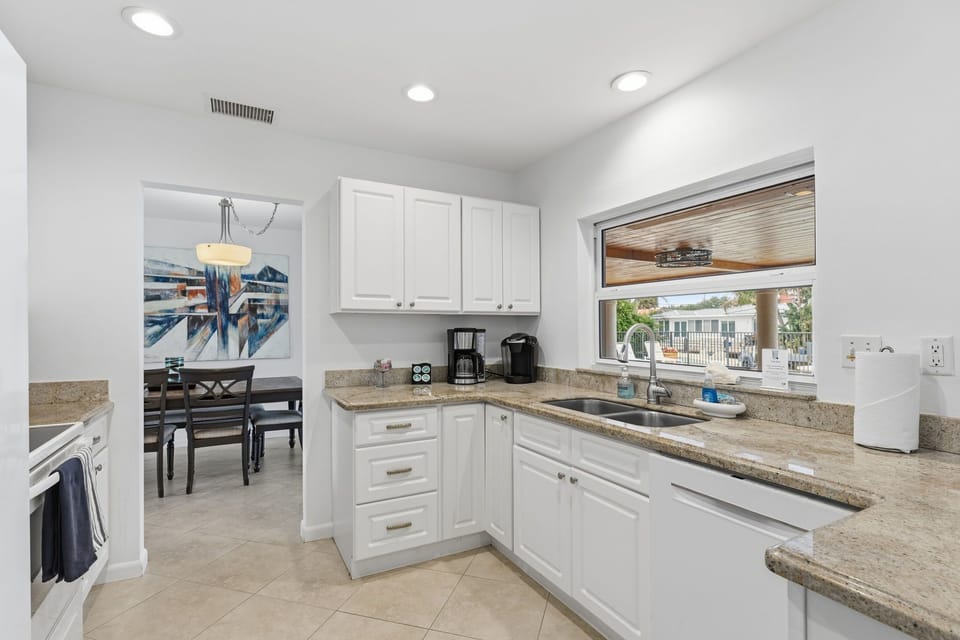 Bright, updated kitchen with sleek finishes and modern style.
