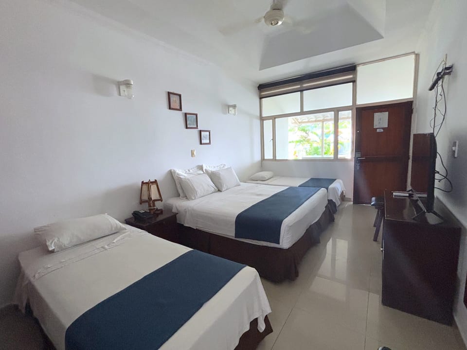 Junior Room, Multiple Beds | Minibar, in-room safe, blackout drapes, free WiFi